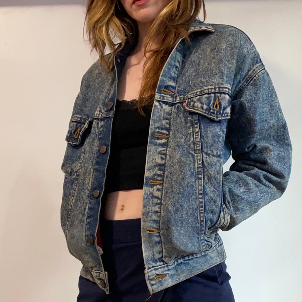 Levi Strauss & Co. vintage denim jacket with red plaid inner lining.